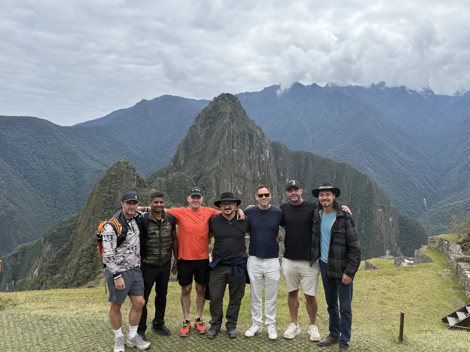 The September 2025 Peru group at Machu Picchu with Huayna Picchu behind them